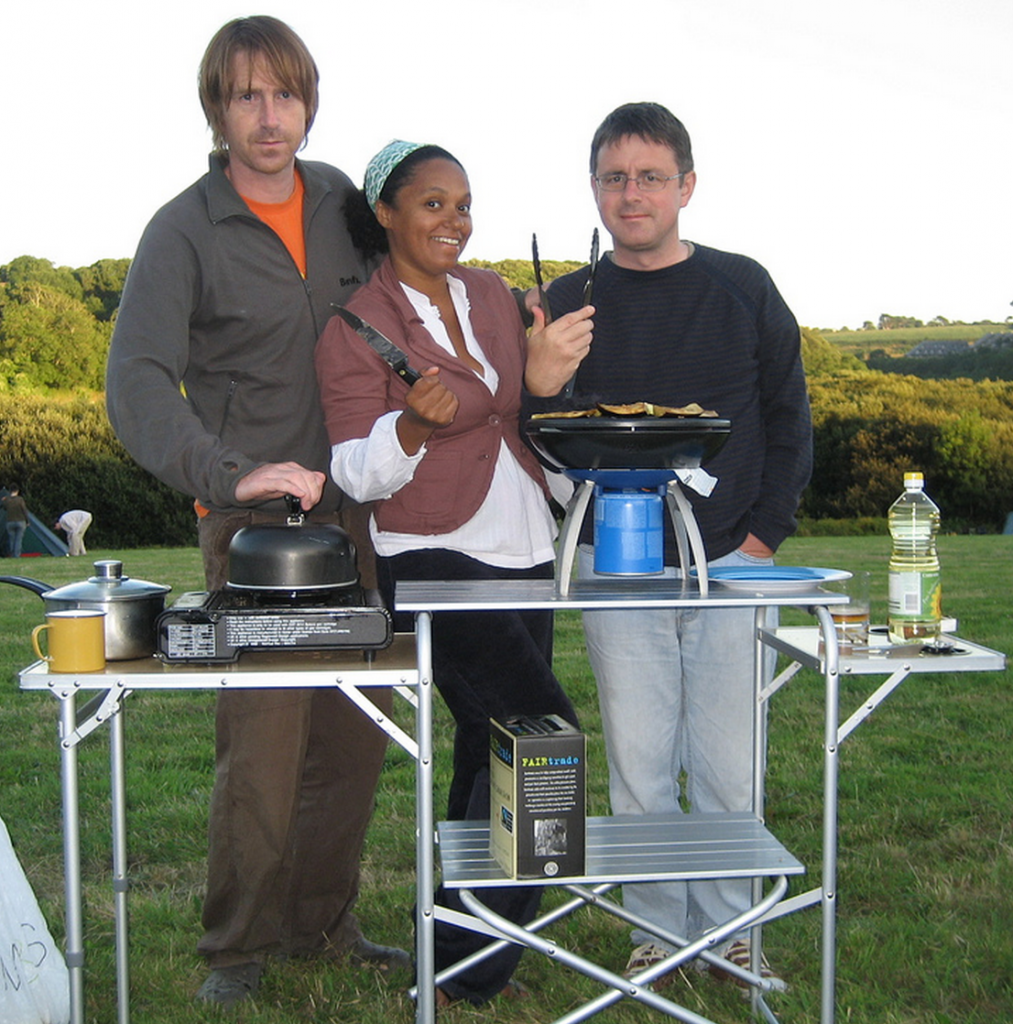 People at a campsite grilling