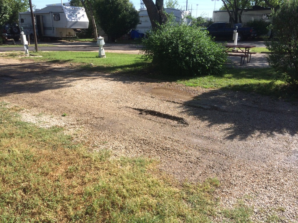 Trench marks left by an RV driving with jacks down