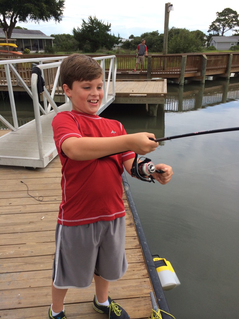 Silas Highland with his first fish on the line.